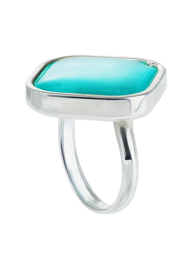 Silver statement ring with large turquoise cabochon stone and split band design